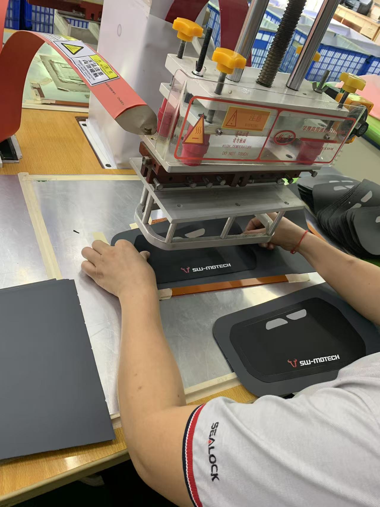 Sealock company workers are operating RF welding machines to weld products. Sealock company workers are operating RF welding machines to weld products.